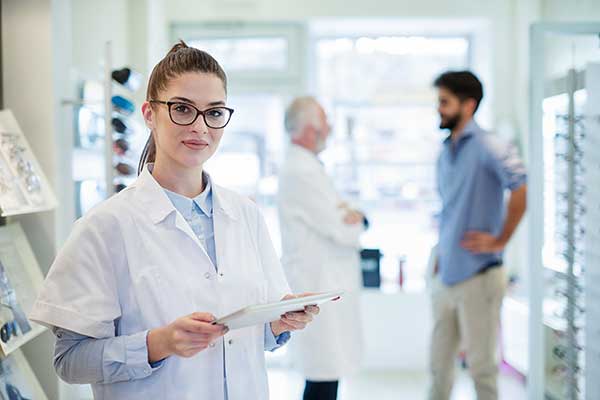 An optician greeting a patient for an appointment